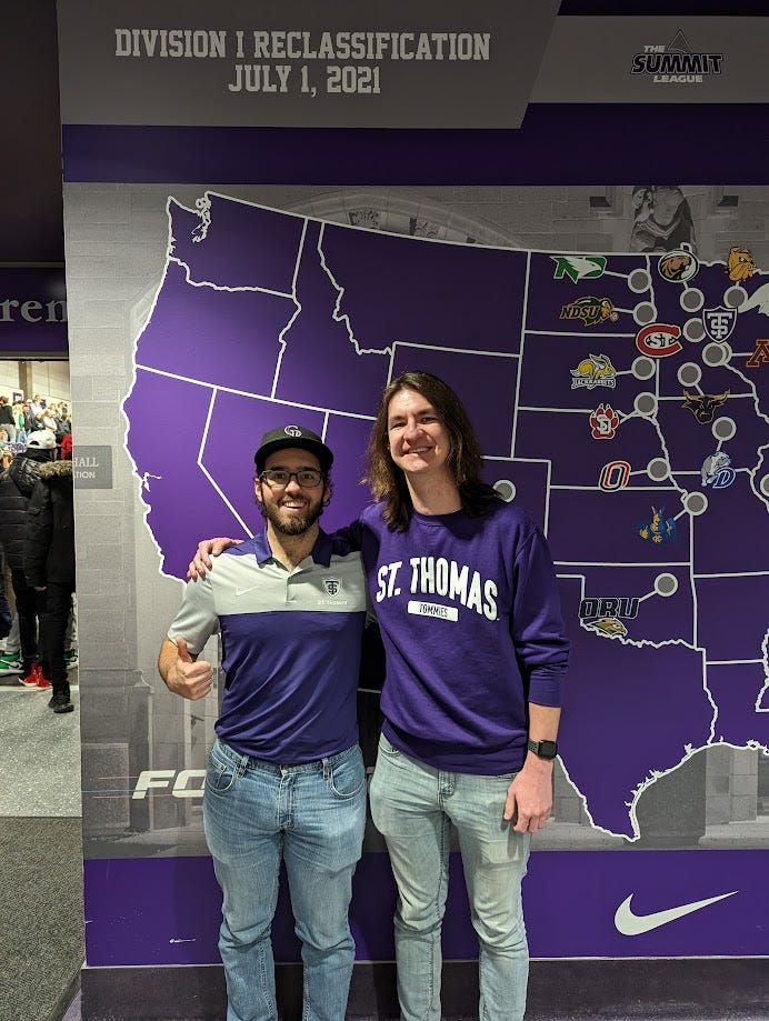Eli and David in front of the conference opponent map