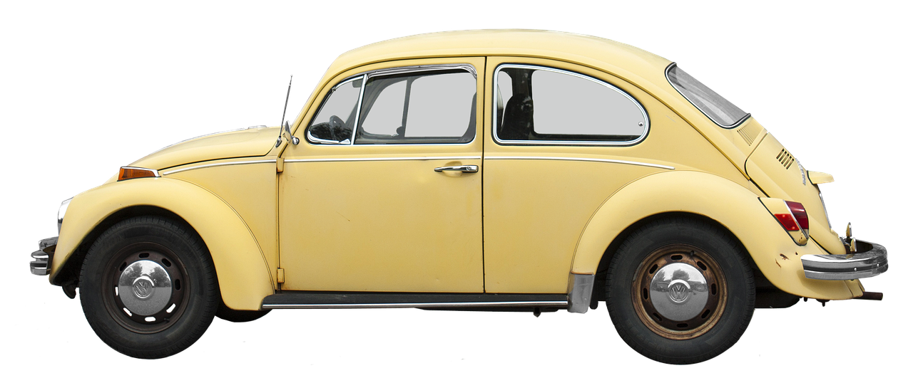 Pale yellow Volkswagen Beetle.