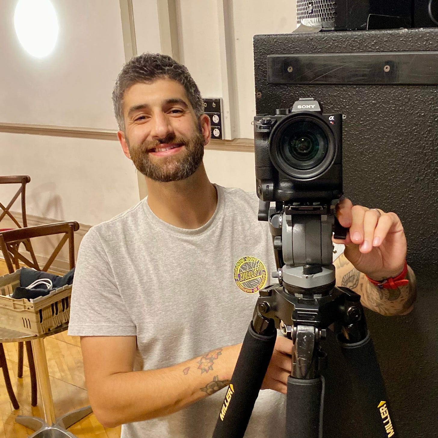 Dario Leonetti - a man smiling with a camera on a tripod