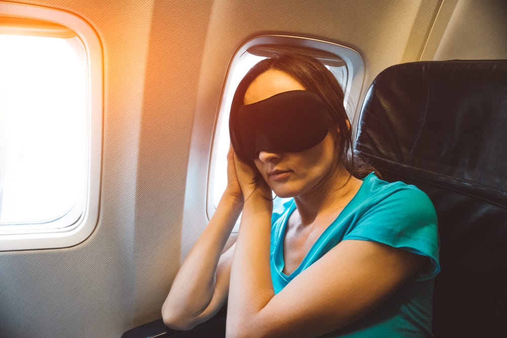 Woman sleeping airplane