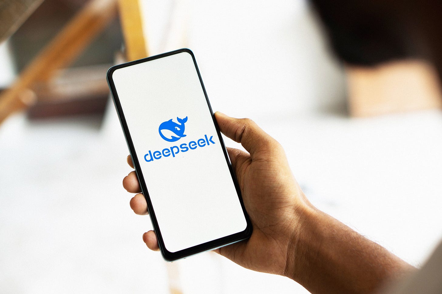 Deepseek Ai logo is displayed on smartphone.