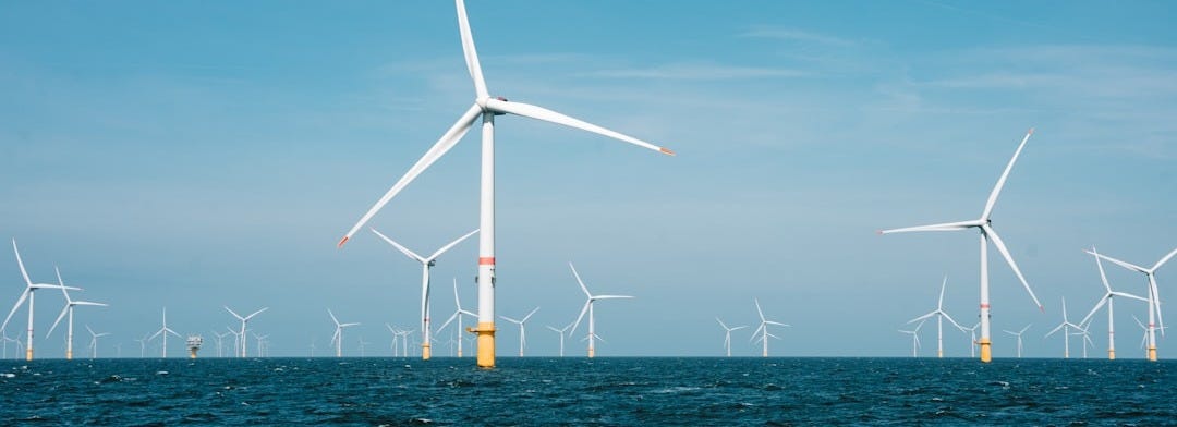 a group of wind turbines in the ocean a group of wind turbines in the ocean