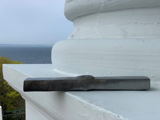 A section from the on-shore portion of Line 5, removed during routine maintenance, according to an Enbridge official with the Straits of Mackinac in the background. Photographed on the porch of the Grand Hotel on Mackinac Island on May 30, 2019.