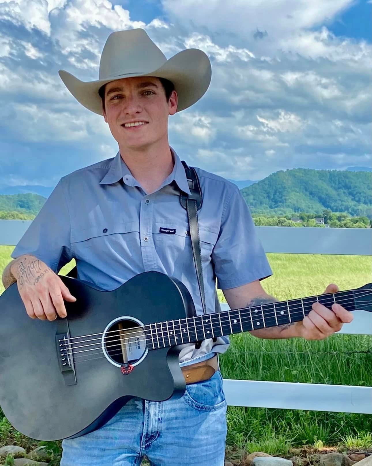 May be an image of 1 person and guitar