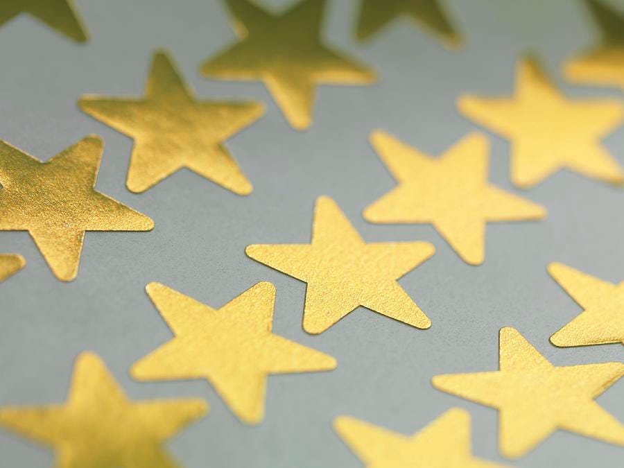 Gold Star Stickers Photograph by Tek Image - Fine Art America