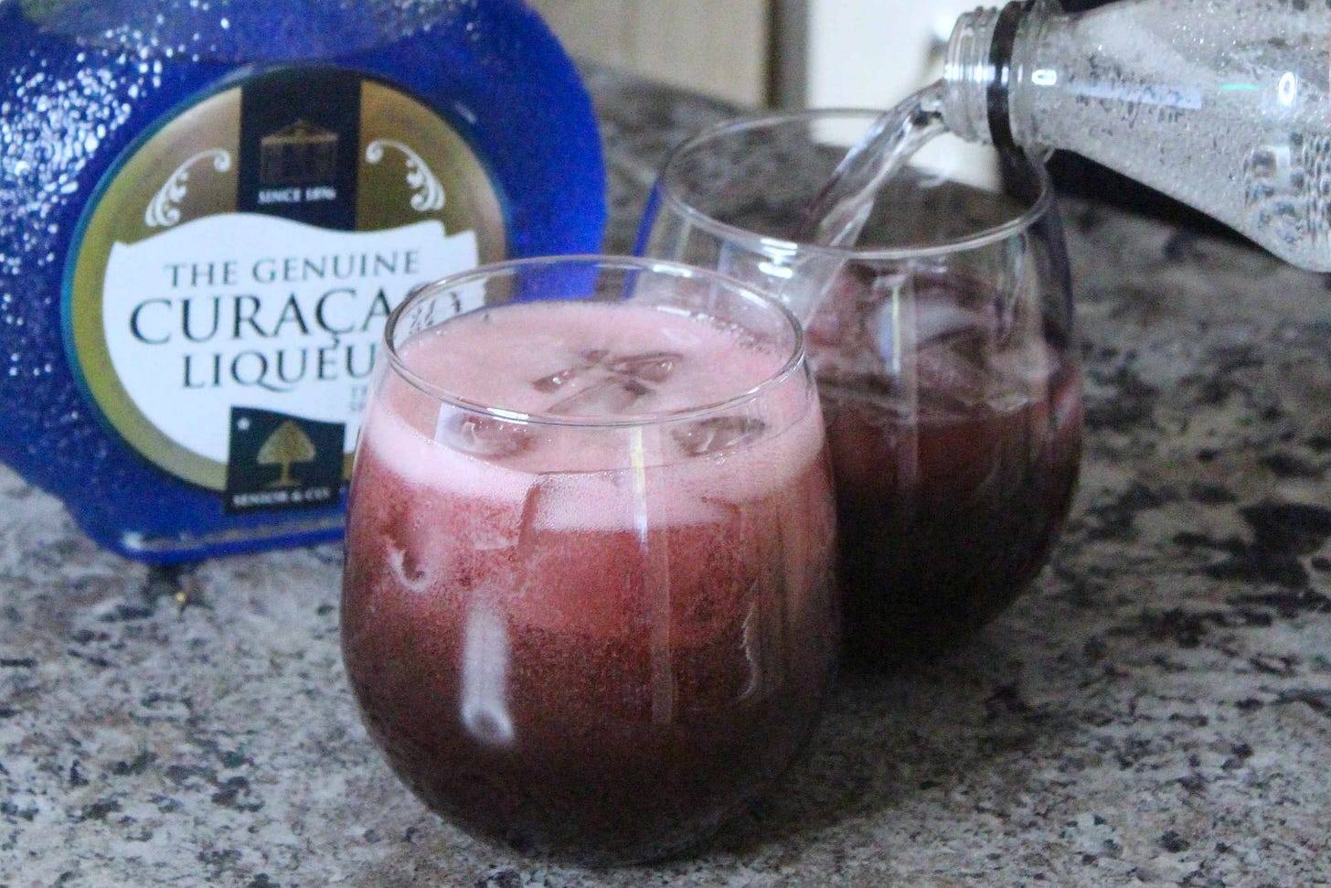 Purple vodka cocktail in a glass 