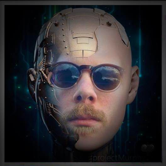 A photo of me from several years ago, wearing subglasses, with circuit board type stuff badly photoshopped onto my head to make me look kinda robotic i guess