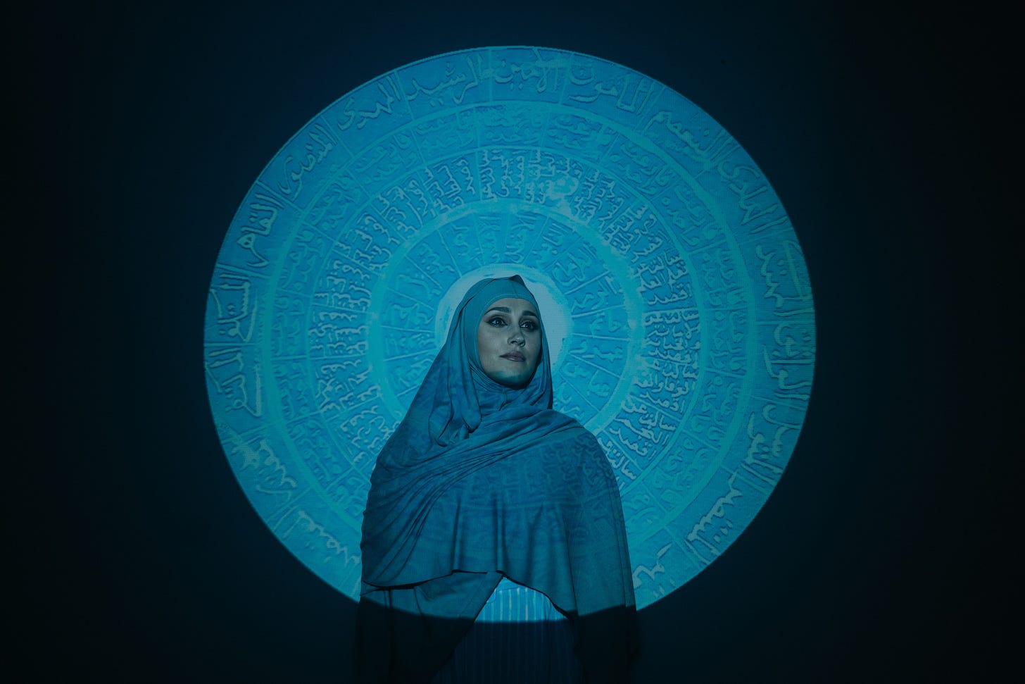 Free Woman in Blue Hijab Standing Beside Blue and White Wall Stock Photo