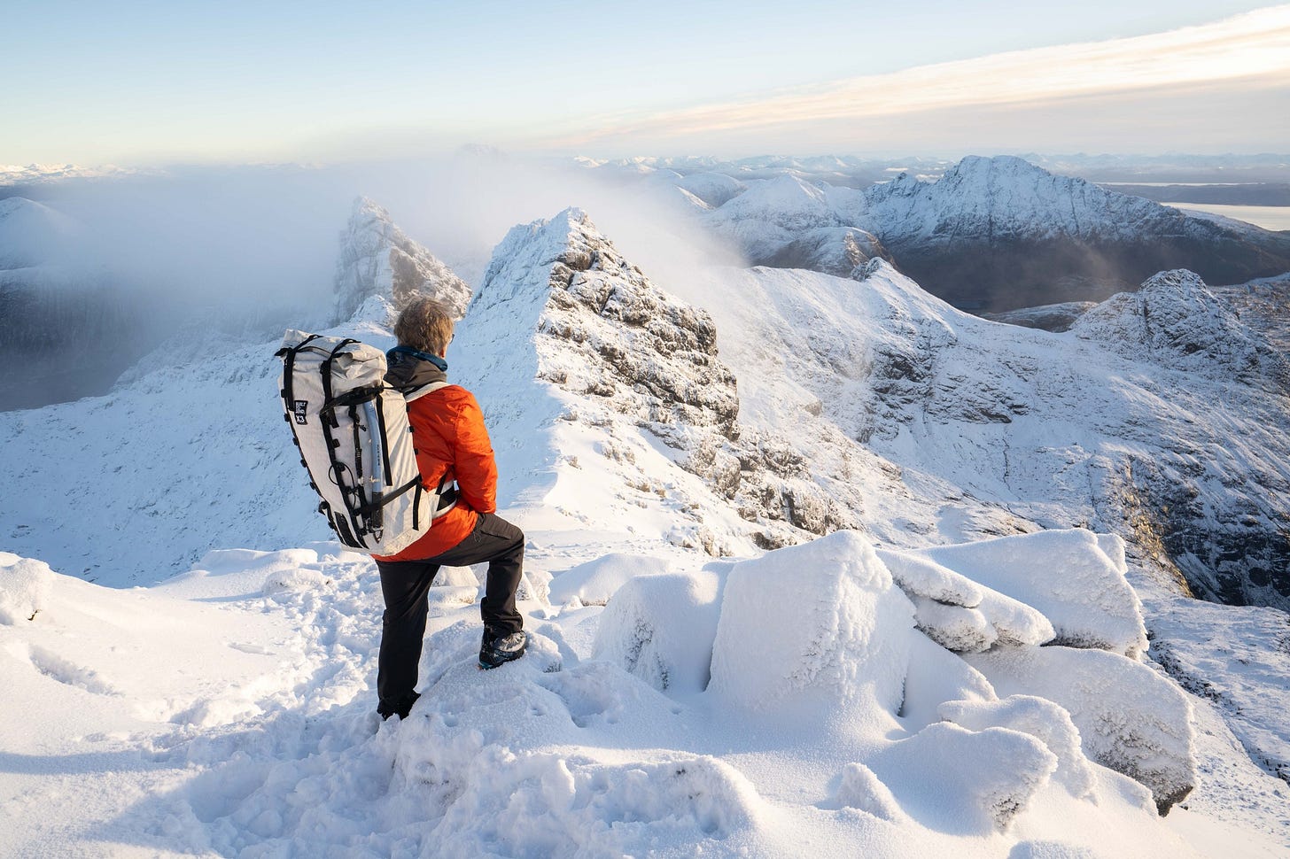 May be an image of 1 person, climbing, arctic, mountain and skiing