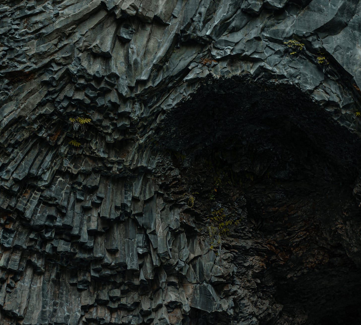dark cave entrance geometric rocks