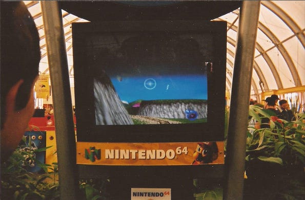 A photo of an attendee playing Pokémon Snap on a Nintendo 64