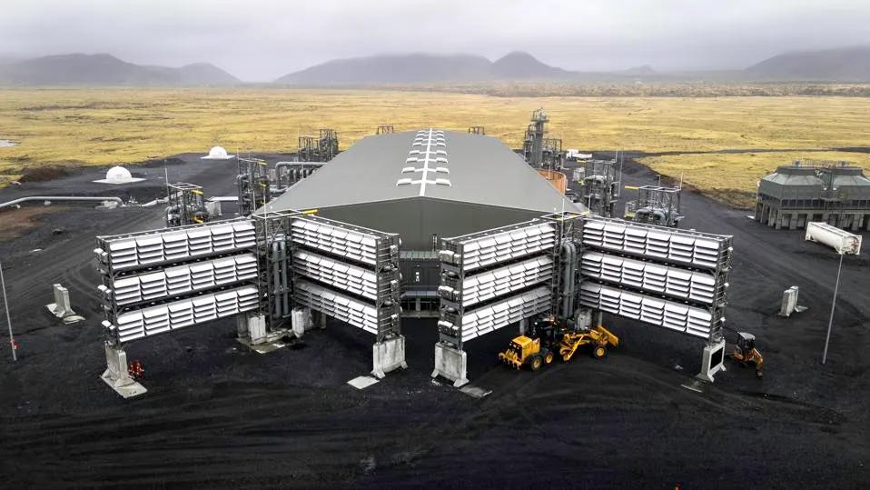 An aerial photograph of large steel structures in the barren Icelandic landscape.