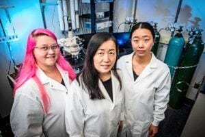 Xin-Yun Lu, MD, PhD, (center) with Graduate Student Kirstyn Denney (left) and Postdoctoral Fellow Yuting Chen, PhD, both coauthors on the new paper