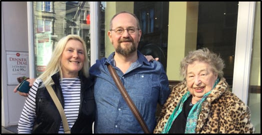 Photo of FIona, Stuart, and Marion Chesney outside a curry house
