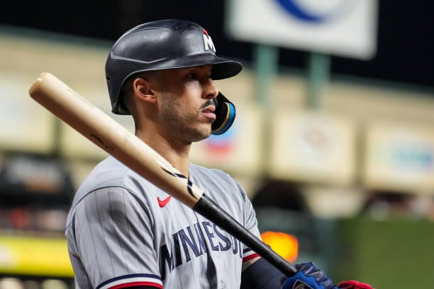 Carlos Correa of the Minnesota Twins looks on during game two of the Division Series against the Houston Astros on October 8, 2023 at Minute Maid...