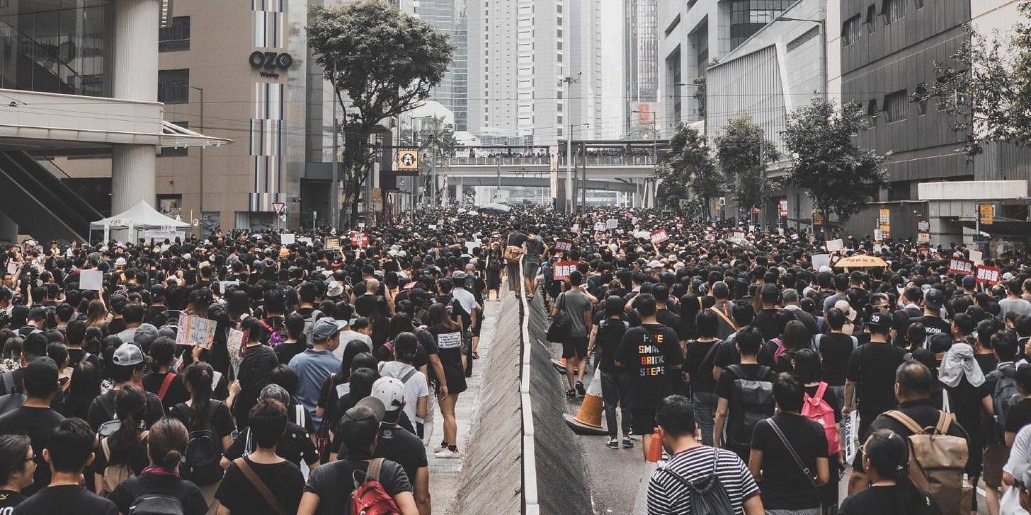 crowd walking down the street