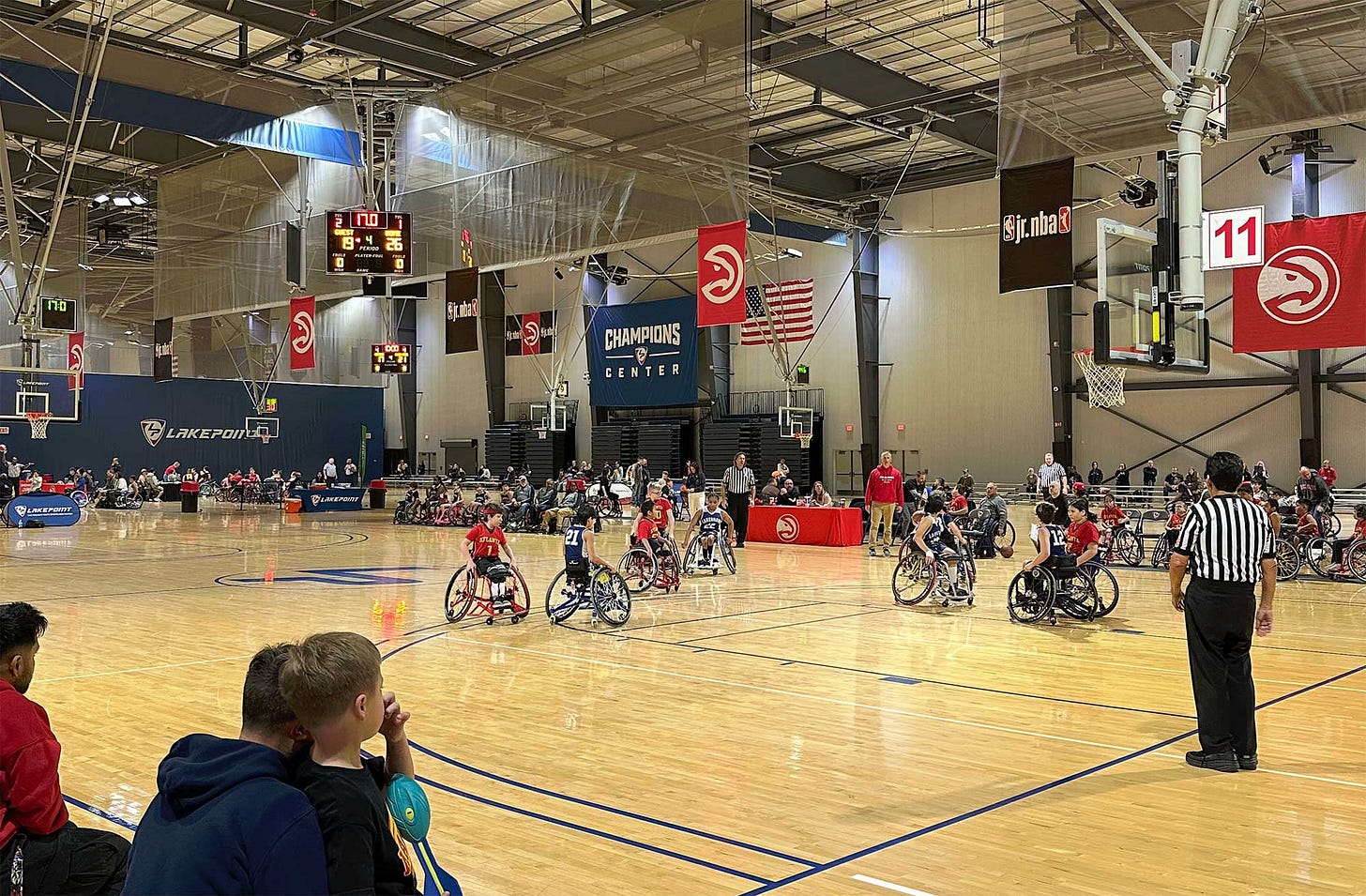 Wheelchair basketball players on the court.