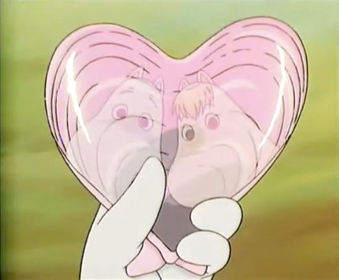 moomin and snorkmaiden reflected in a heart shaped shell