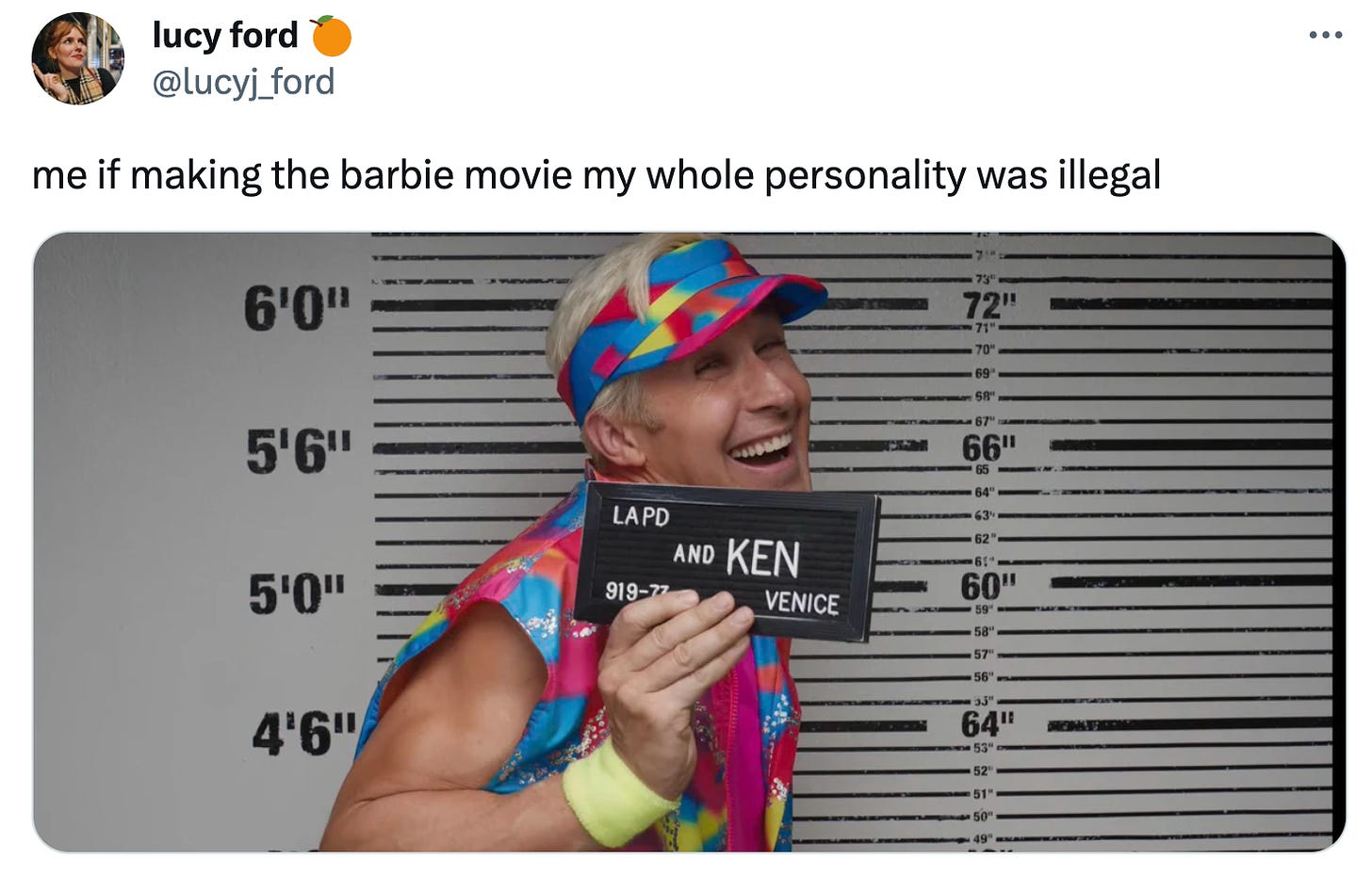 A tweet from Lucy Ford. It shows Ken’s police photograph from the Barbie movie. He’s grinning delightedly, wearing a neon visor and sweat bands. The mugshot board gives his name as “And Ken.” Lucy’s caption reads: "me if making the barbie movie my whole personality was illegal.”