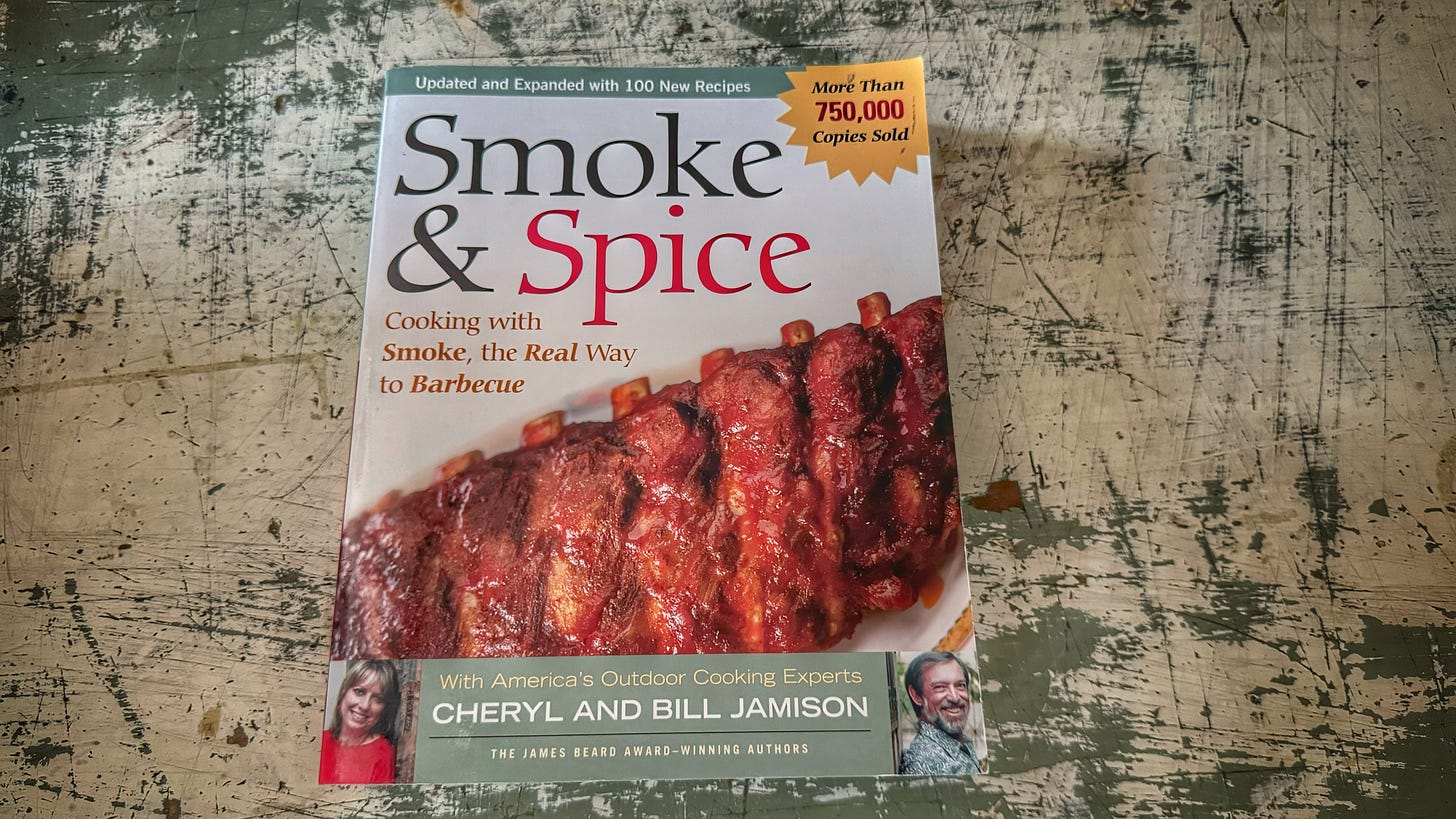 A copy of Cheryl and Bill Jamison's "Smoke & Spice." The cover shows a rack of saucy barbecue ribs