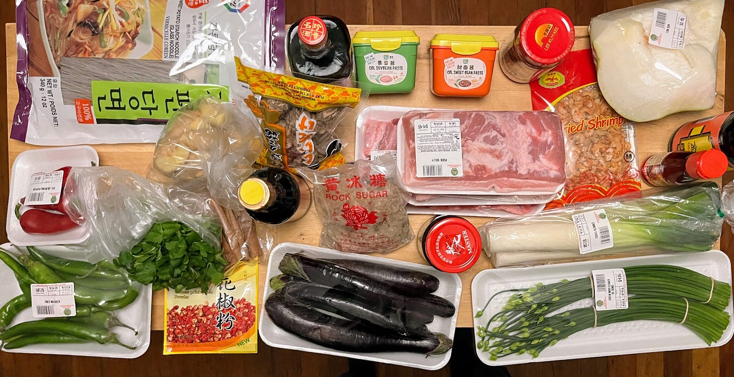 Grocery haul from the Asian grocery store, featuring various pantry items, vegetables and meats