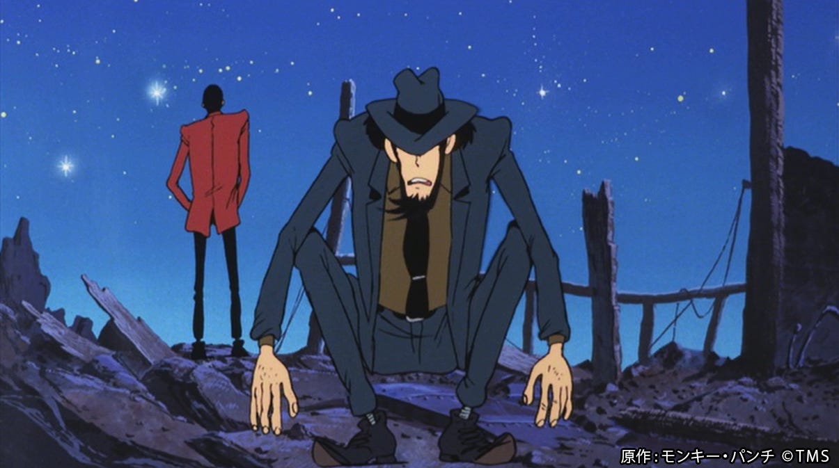 Immagine di Lupin (di spalle, in secondo piano, con la giacca rossa) e jJigen, sulla destra, accucciato. Attorno a loro ci sono i resti di un'esplosione. Sullo sfondo il cielo stellato.