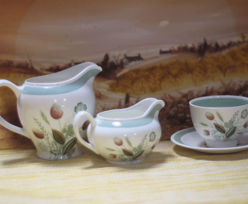 china tea set on yellow fabric in the home