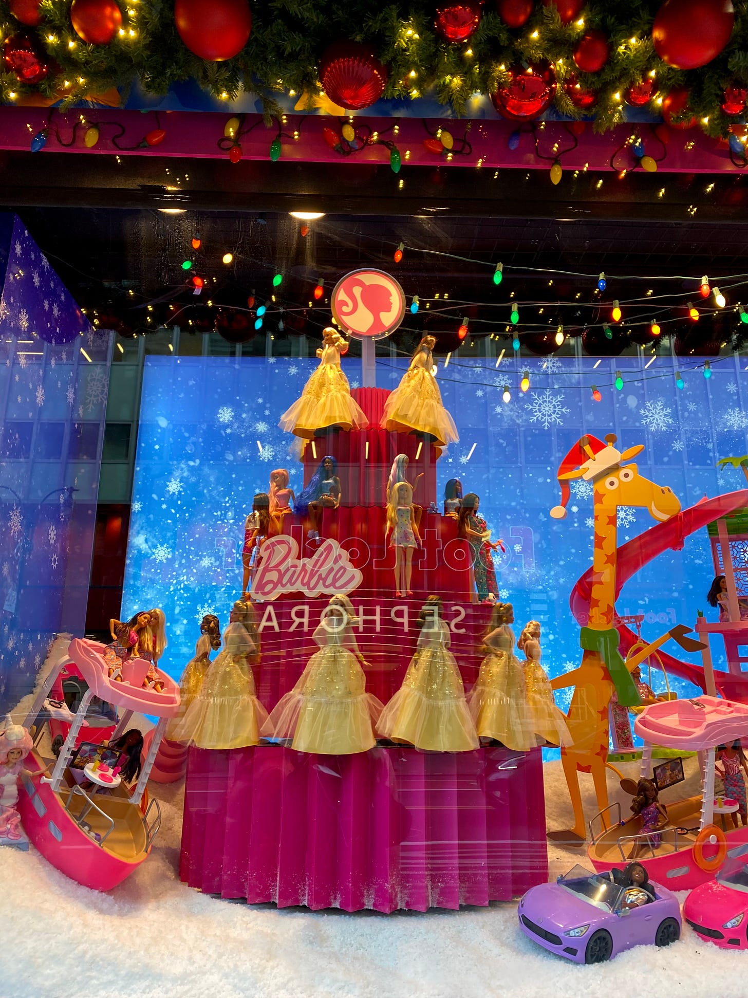 A Barbie-themed Macy's holiday window display.