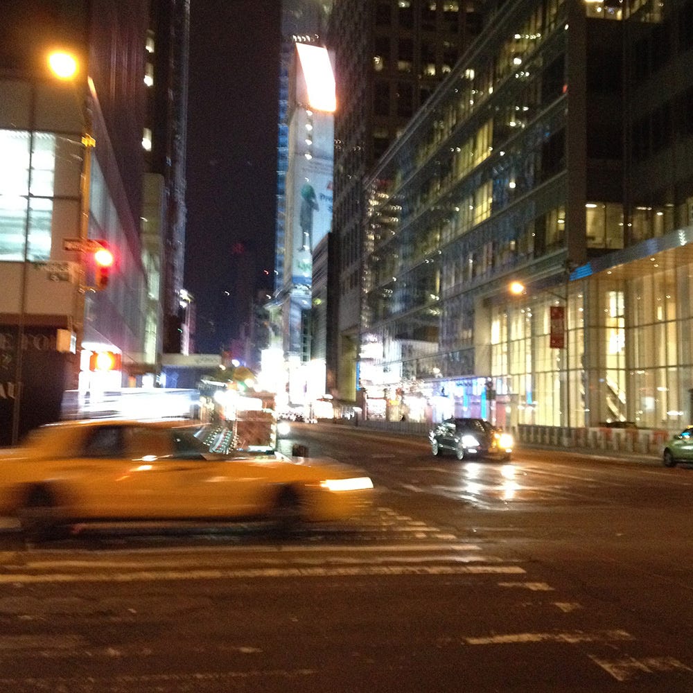 Photograph of early morning New York with yellow taxi cab