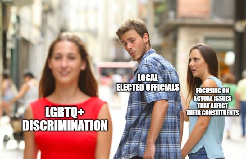 man in "local elected officials" shirt ogling woman in red dress with "LGBTQ discrimination" while angry girlfriend's shirt says "focusing on local issues that affect constituents"