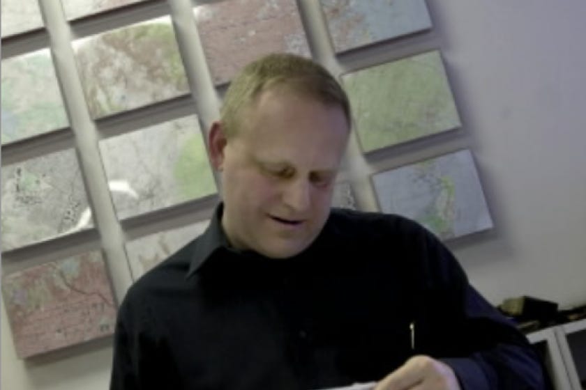 Cartographer Dennis McClendon at work on changes to a map for the state of Illinois in 2003.