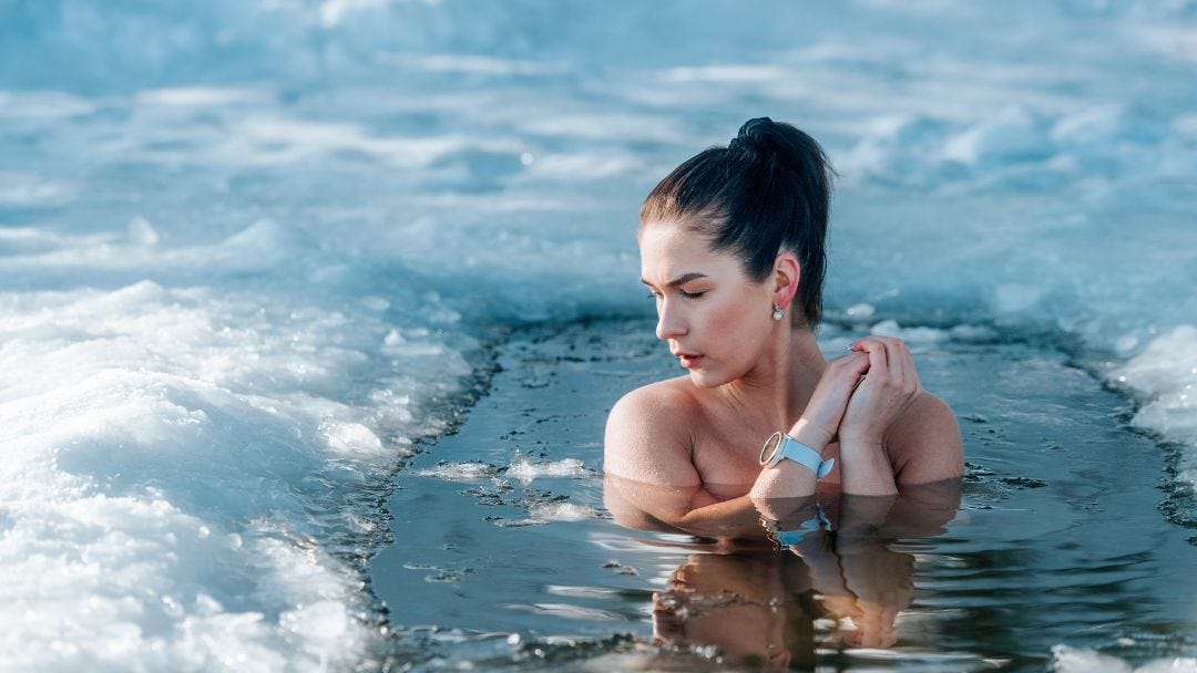 Embracing discomfort Woman sitting in an ice bath as a character-building exercise.