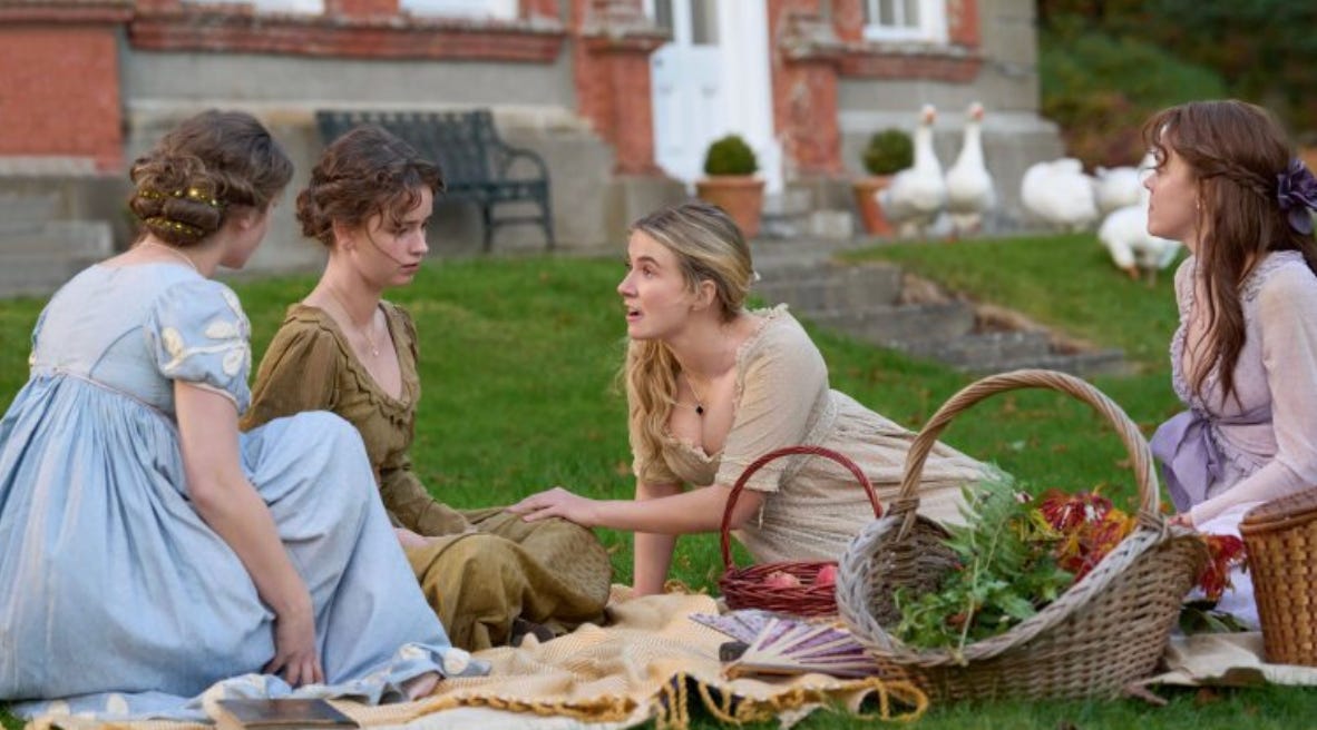 Four women in Regency dress picnicking