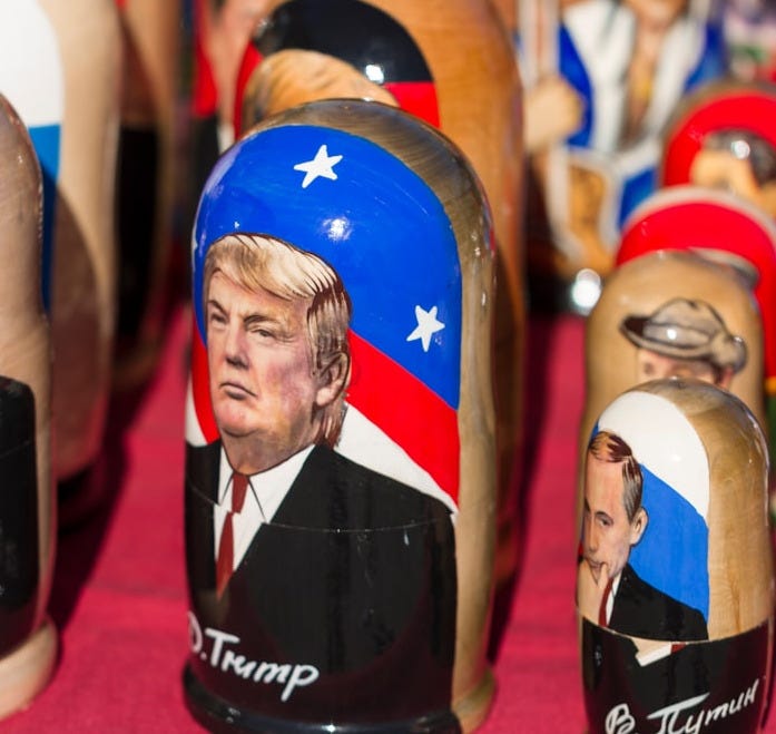 Donald Trump nesting dolls on red textile