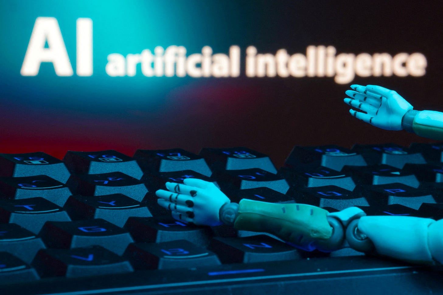 Illustration shows message reading "AI artificial intelligence", keyboard and robot hands