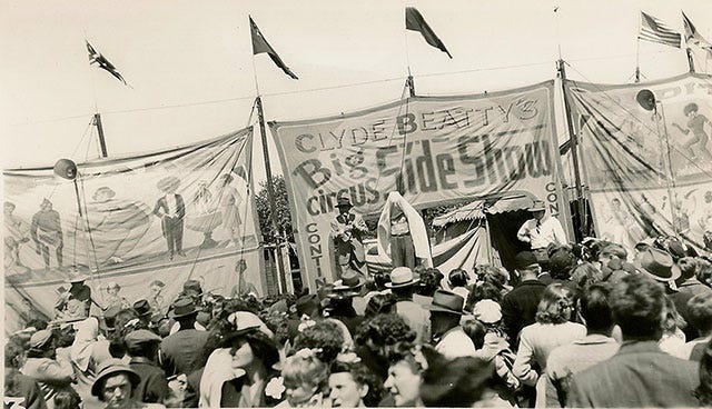 Vintage photos of a crowd gathered to see Clyde Beatty's circus freaks
