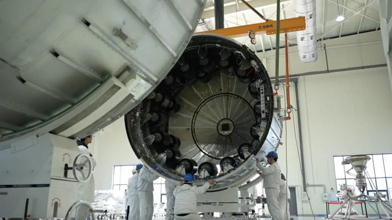 Workers inspecting the avionics section of the Zhuque-3 hop test vehicle.