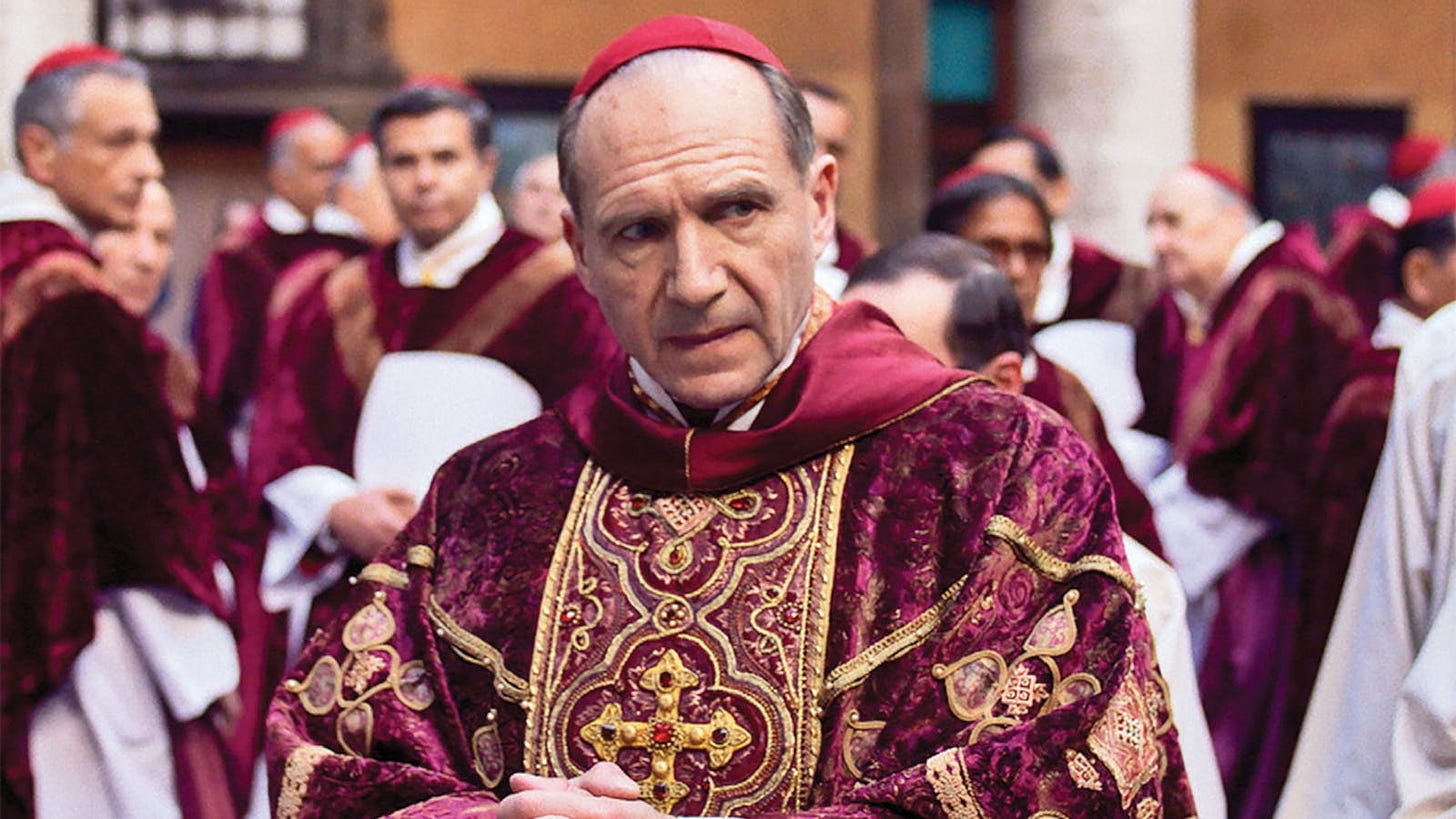 Cardinal-Dean Thomas Lawrence (Ralph Fiennes) looking warily thoughtful in Conclave 