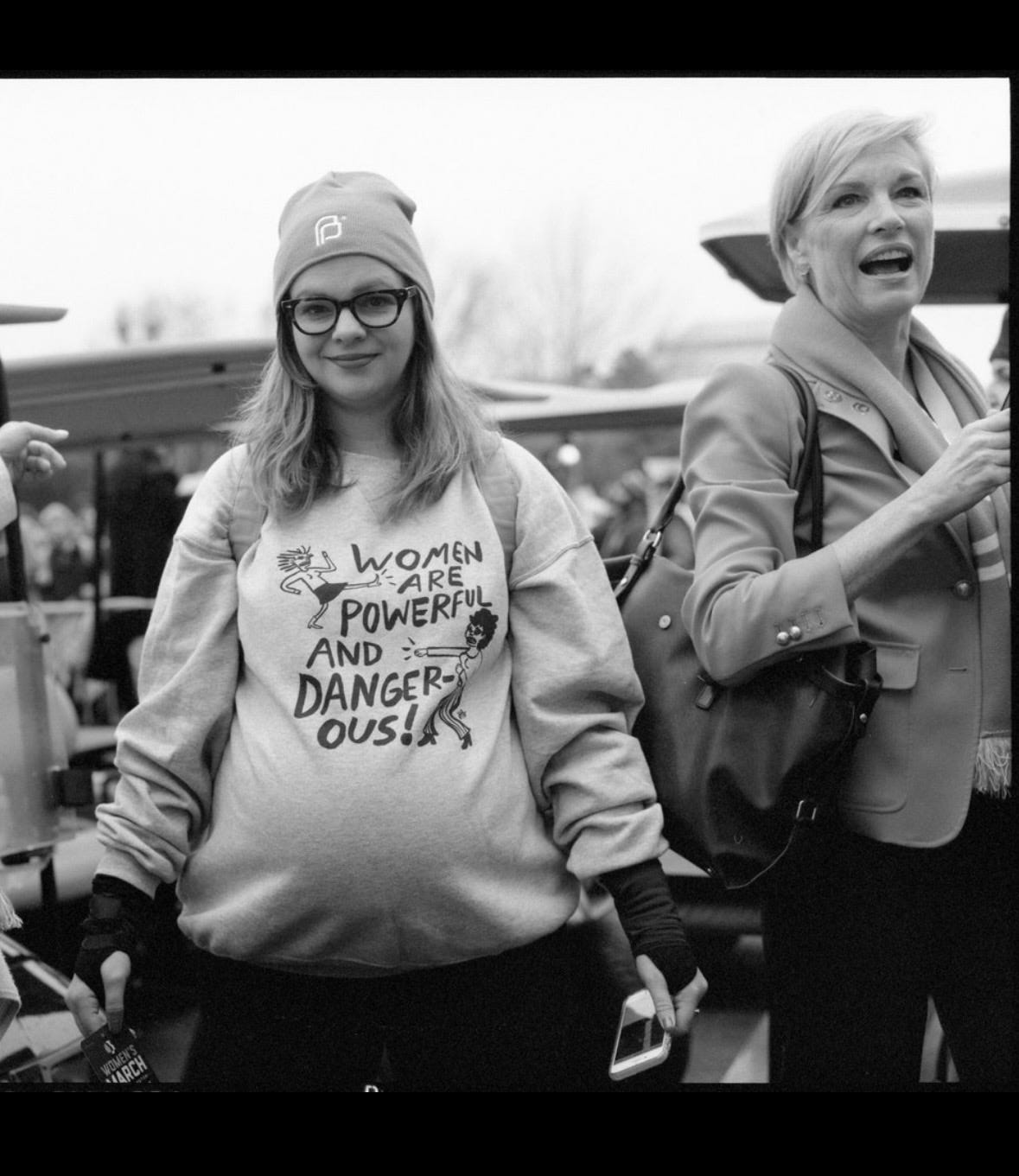 A black and white photo of Amber and Cecile at the Women's March in 2017.