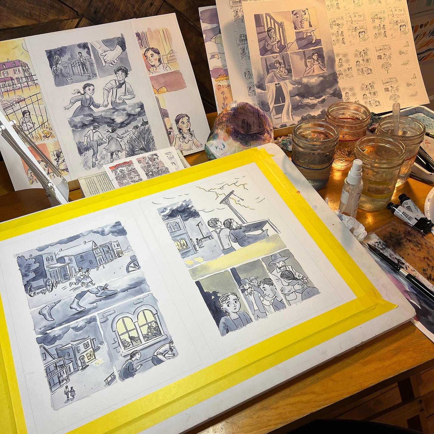 The studio desk of cartoonist K. Woodman-Maynard as she works on a watercolor graphic novel.