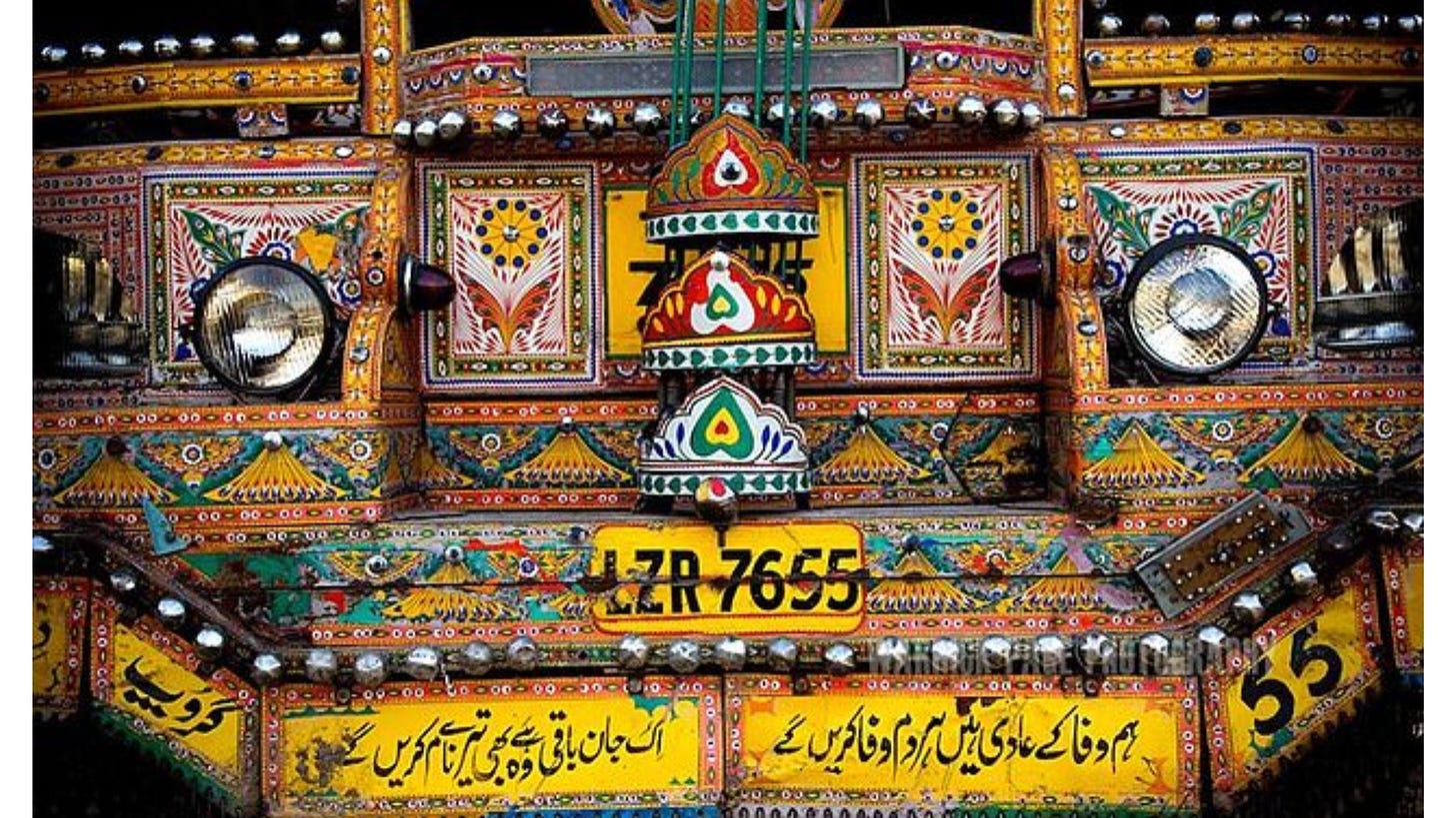 Colorful front bumper of a Pakistani ‘art truck’ with intricate designs and lettering on .