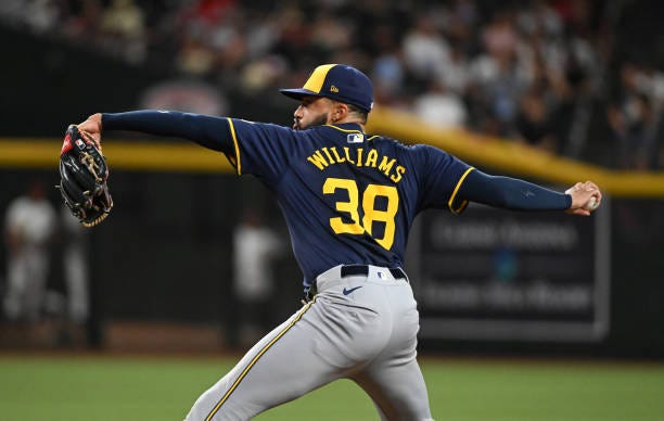 Devin Williams of the Milwaukee Brewers delivers a ninth inning pitch against the Arizona Diamondbacks at Chase Field on September 13, 2024 in...