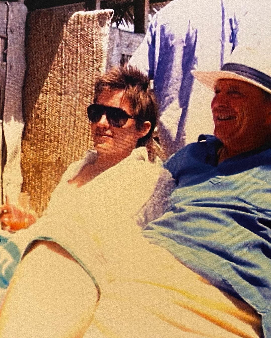 A young Edo with Christopher Shale seated and smiling