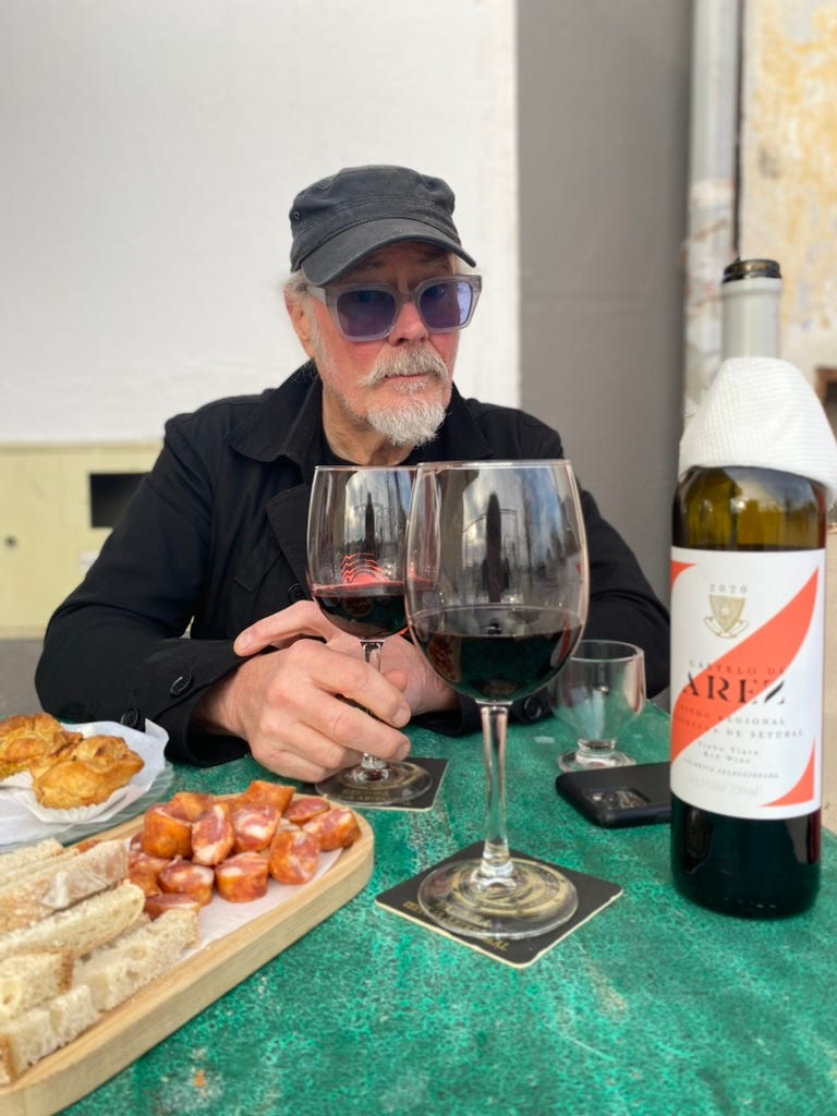 A man with local produce and wine