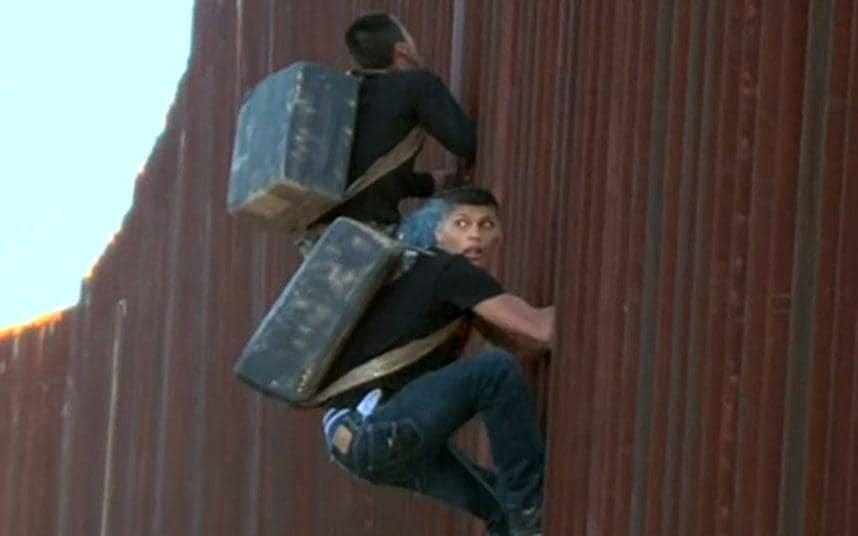 Suspected drug smugglers caught crossing US-Mexico border fence
