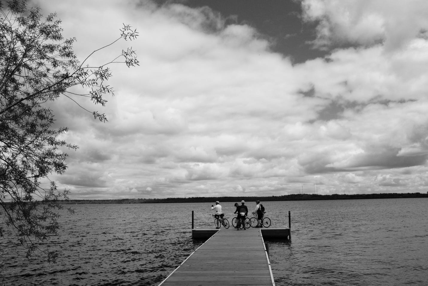 A group of people riding bikes on a dock

AI-generated content may be incorrect.