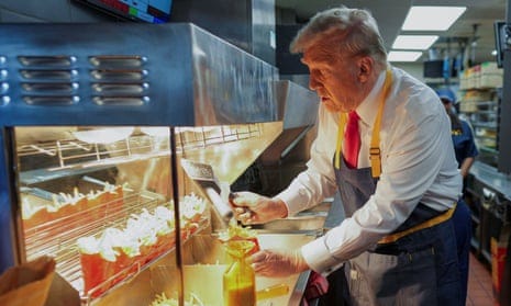 Donald Trump makes fries during staged campaign event at McDonald's – video  | Donald Trump | The Guardian