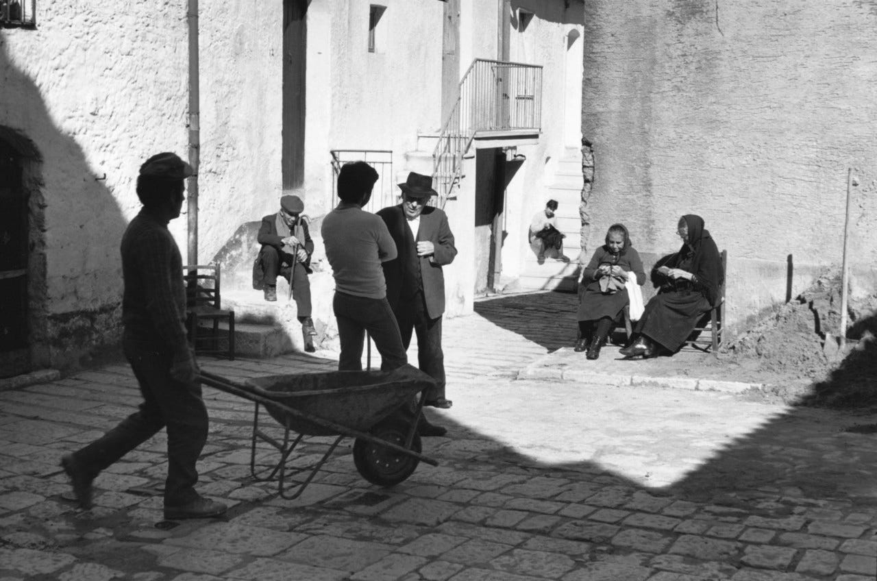 Photo of people socializing in Matera's Sassi taken by Henri Cartier-Bresson