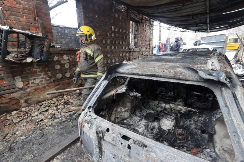 Firefighters deal with the aftermath of the Russian drone attack in the Nemyshlianskyi district. -/Ukrinform/dpa