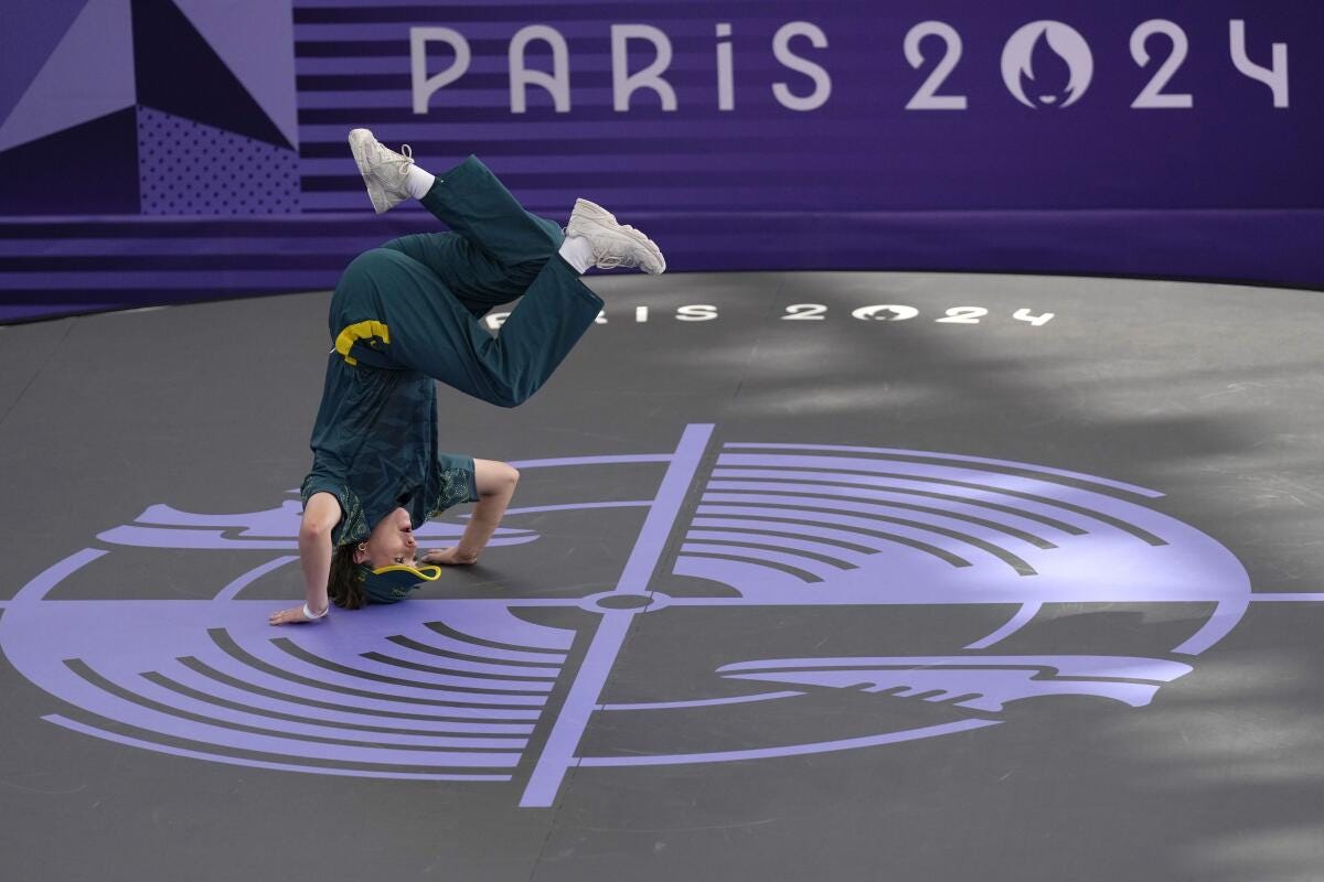 Australia's Rachael Gunn, known as B-Girl Raygun, stands on her head during the breaking competition at the Paris Olympics